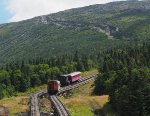 MWCR M7 (orange locomotive - heading up the mountain) passes MWCR 2, (Black locomotive), which is heading downhill